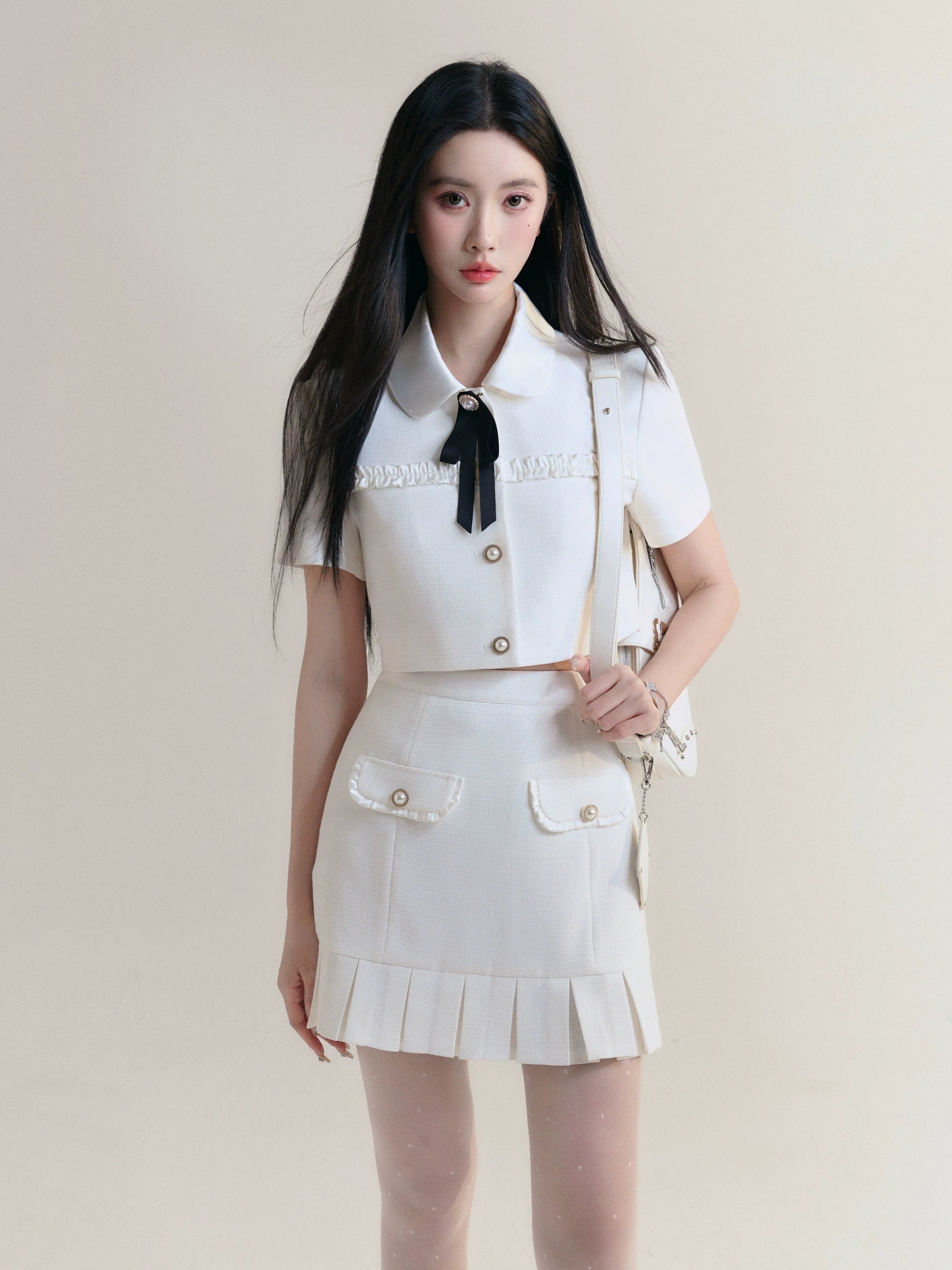 Ivory Elegance Bow-Tie Crop Blouse and Pleated Mini Skirt Set Backless Summer Blouse Ivory Elegance Bow-Tie Crop Blouse and Pleated Mini Skirt Set Backless Summer Blouse